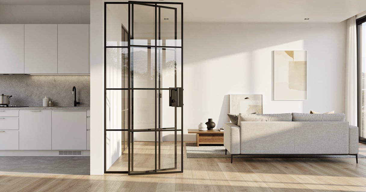 Porte vitrée intérieure de style atelier avec structure acier noir et verre clair dans un séjour lumineux